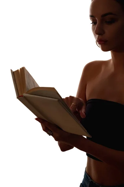 Female silhouette reading literature open book — Stock Photo, Image
