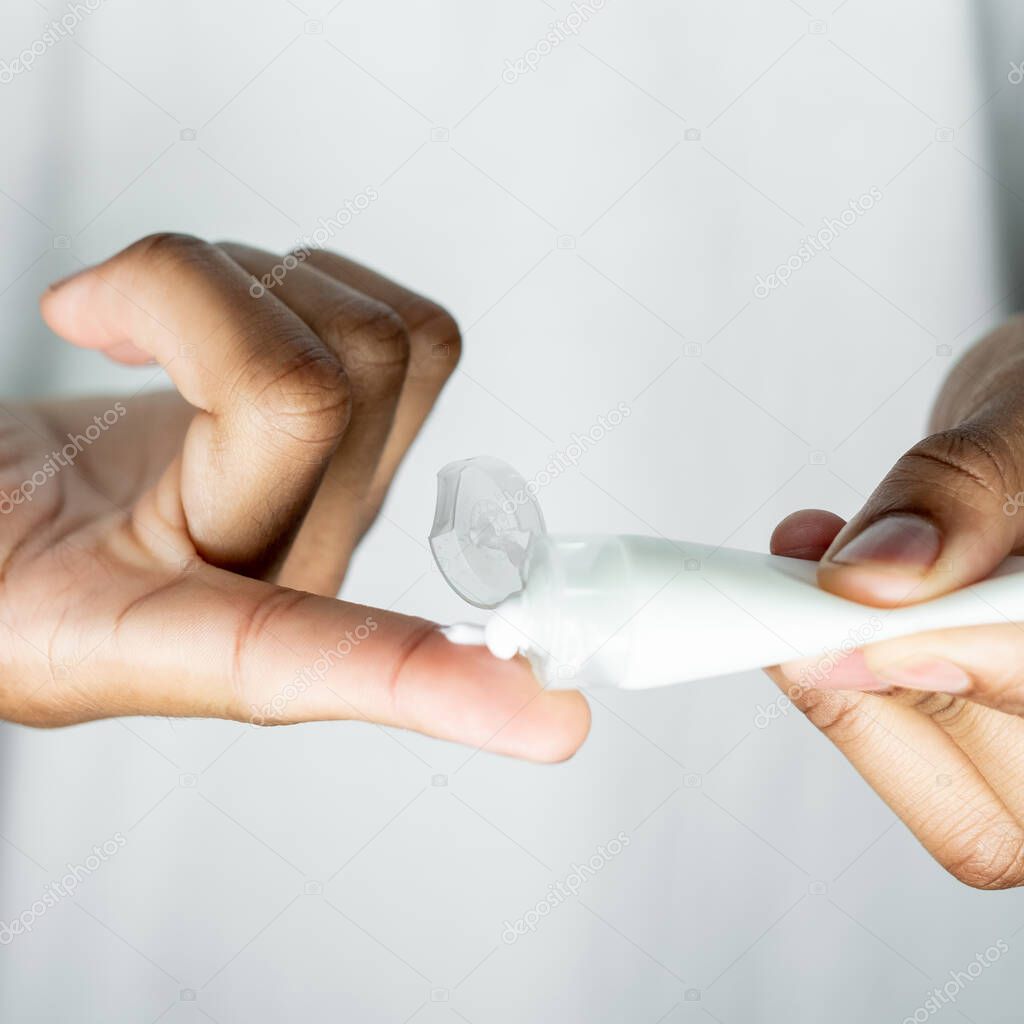 man skincare cosmetic product hands cream tube