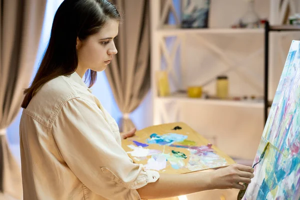 Female artist painting process professional art — Stock Photo, Image