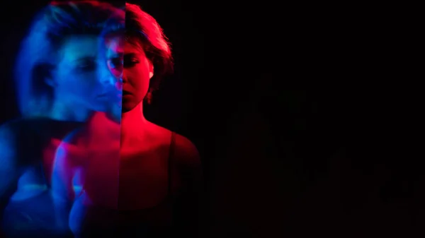 Bipolar disorder upset woman in pink blue light — Stock Photo, Image