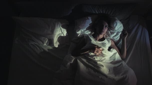 Night insomnia trouble sleeping woman in bed awake — Stock Video