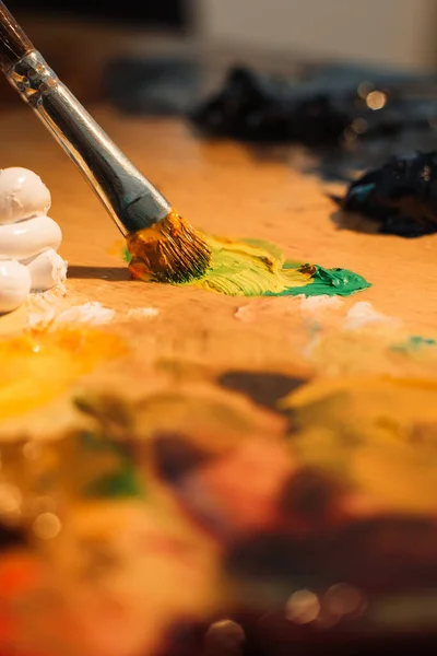 Painting hobby art process hand paint on palette Stock Photo by