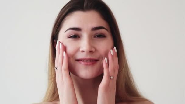 Facial care skin treatment woman touching face — Stock Video