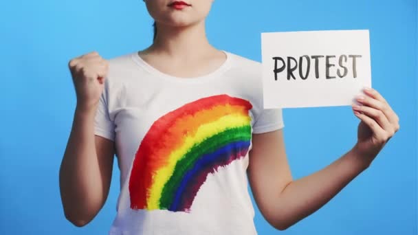 Lgbt protest lesbian activist raising fist placard — Stock Video