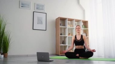 yoga online home meditation relaxed woman laptop