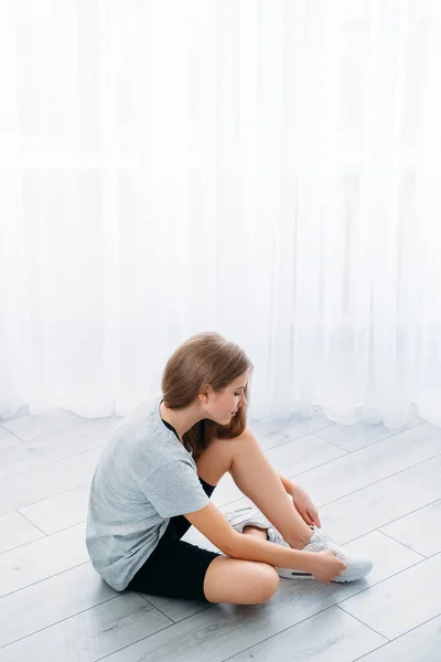 Active children home fitness girl tying shoelace —  Fotos de Stock