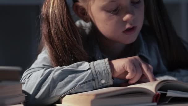 Late study bored schoolgirl reading book night — Stock Video