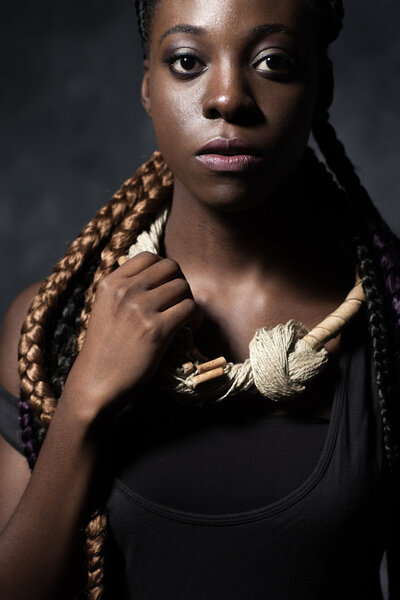 self-assured African woman and collar