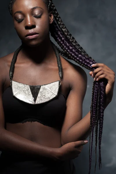 African woman with very long hair braided in multi-colored braid — Zdjęcie stockowe