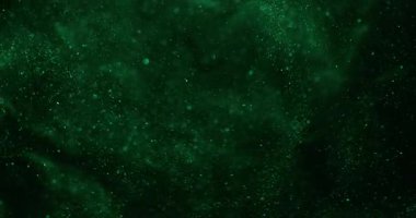 Bulanık parçacıklar. Parlak doku. Doğal yeşil renk aydınlatmalı parlak sanat soyut bokeh koyu siyah arkaplanda yüzüyor..