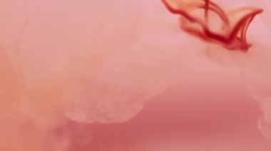 Renkli mürekkep. Odaklanamayan akış. Turuncu boya, su altında fantezi fırıl fırıl dönüyor. Parlak sis dalgası karışımı boya sisi soyut arkaplan.