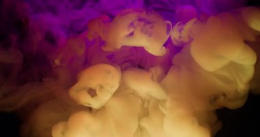 Paint cloud. Neon fume water. Defocused pink purple blue color glitter stardust splash swirl particles shiny rainbow spill on abstract dark black background.