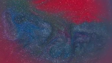 Mürekkep sıçraması. Renkli akış. Odaklanmamış kırmızı mor parıltı kabarcıkları parlak ıslak doku soyut yaratıcı arka plana sıçrar.