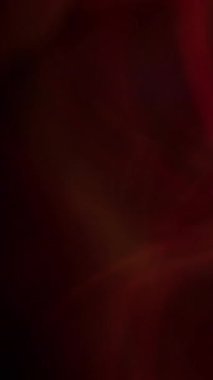 Dikey video. Bulanık renk parıltısı. Odaklanamayan ışık patlaması. Kırmızı mavi, mor, parlak, yanıp sönen bokeh daireler koyu siyah, soyut arka planda parıldıyor..