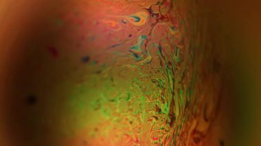 Spektrum bulanık yağ. Pigment karışımı. Canlı renkli ışık dalgası enerji parıltısı. Soyut mürekkep akışı fantezi kırmızı yeşil sanat arka planı.