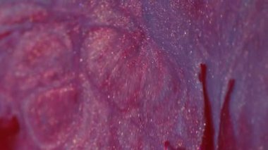 Parlak mürekkep karışımı. Parlak sıvı sıçraması. Odaklanmamış pembe renk parçacıkları dokusu akrilik emülsiyon sızıntısı soyut sanat arka planı.