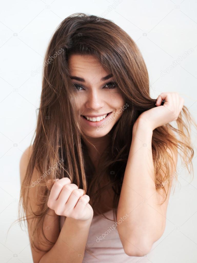 the beautiful laughing girl with long healthy  hair