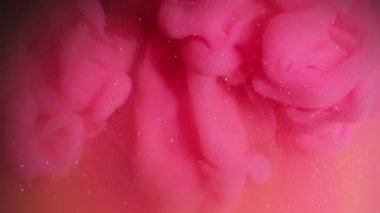 Boya damlası. Parıldayan dalga dokusu. Odaklanamayan pembe turuncu renk akrilik su soyut yaratıcı sanat arka planına yayılıyor..