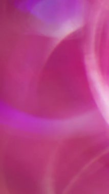 Dikey video. Çember mercek fişeği. Bulanık renkli neon. Işık soyut yuvarlak parçacıklar parlaklığı bokeh arkaplan ile parlar.