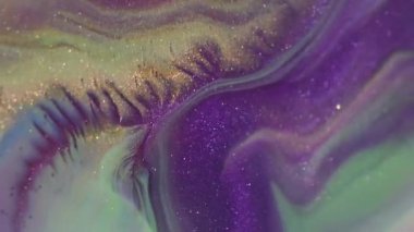 Mürekkep sıçraması. Parlak doku. Odaklanamayan mor yeşil renkli boya soyut bokeh sanat arka planına yayılan titreşimli parçacıklar..