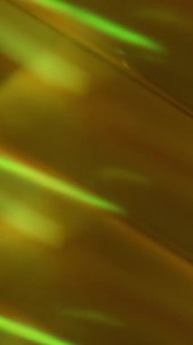 Dikey video. Bulanık geometrik işaret fişeği. Hareketli renkler. Görsel ışıltı sarı kırmızı kaleydoskop mercek parıltısı soyut ışık sanat arkaplanını açıyor.