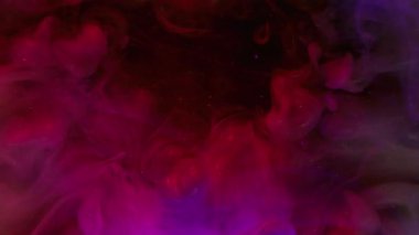 Sparkling ink mist. Neon smog vapor. Defocused pink purple blue paint rainbow glitter fume water splash spreading on abstract background.