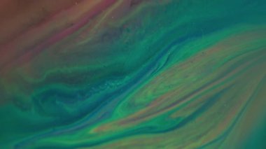 Mürekkep sıvısını karıştır. Boya akışı. Soyut sanat arka planında parlayan sarı, mavi, pembe, parlak pigmentler..