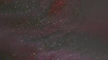 Bokeh sim akışı. Mürekkep suyu. Soyut yaratıcı bokeh arkaplanda yüzen mor, kırmızı, ışıl ışıl, parlak, ıslak pigment dokusu.