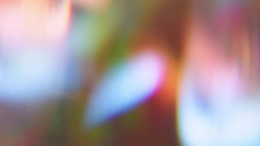 Görüntü canlı mercek. Gradyan ışık. Renkli ışıltı dokusu karıştırıcı ışın. Turuncu yeşil mavi soyut arkaplanda optik yansıma.