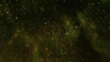 Bulanık daireler. Parıldayan ışık. Soyut koyu renkli siyah bokeh arkaplan üzerinde odaksız sarı renkli optik parlak parlak parlak yuvarlak dokuma.