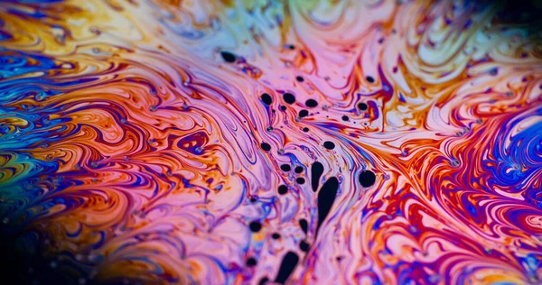 Mürekkep dalgası bulanıklığı. Girdap sabunu. Parlak renkli pigment eğri benzin akışı. Turuncu mavi mor yağ akışı soyut arkaplan dokusu.