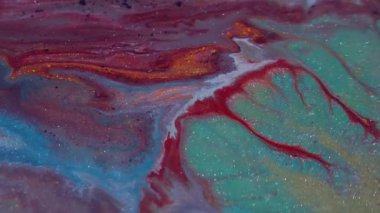 Parıldayan mürekkep. Köpüklü sıvı karışımı. Odaklanmamış kırmızı turuncu renkli parlak su mermer deseni soyut sanat arkaplanına dökülmüş..