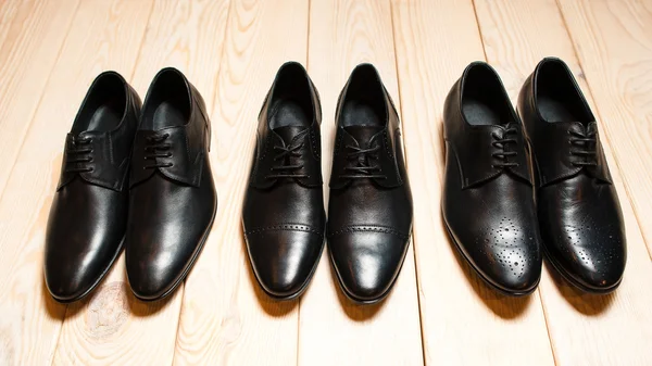 Set of men's  leather shoes on wood — Stock Fotó