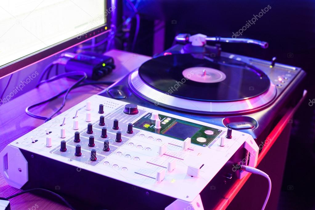 Dj vinyl player and mixer in studio