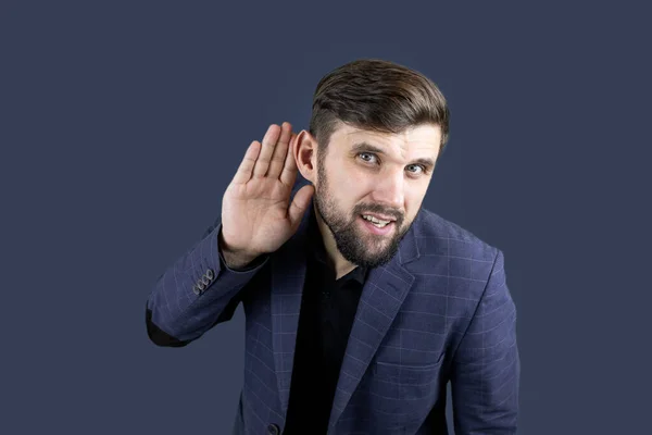 Businessman Blue Suit Puts His Hand His Ear Trying Hear — Stock Photo, Image