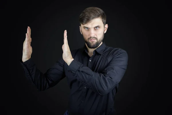 Man Black Shirt Black Background Shows Palms His Hands Gestures — Stock Photo, Image