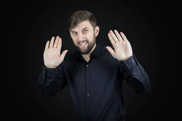 Man Black Shirt Black Background Shows Palms His Hands Gestures — Stock Photo, Image