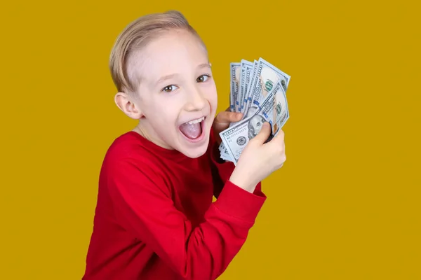 Cheerful Child Red Holds Bundle Dollar Bills Front Him Makes — Stock Photo, Image