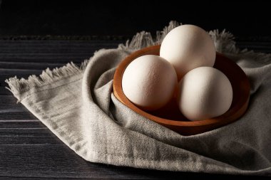 white chicken eggs in container