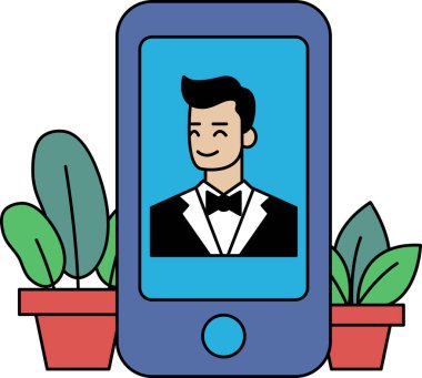 Bir adam telefonda kameraya gülümsüyor. Adam takım elbise ve kravat takıyor.