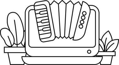 Masanın üzerinde bir klavye ve küçük bir akordeon var. Akordeon siyah beyaz.