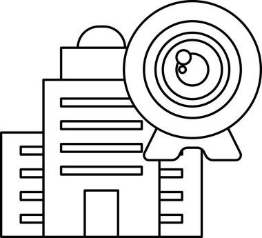 Tepesinde kamera olan bir bina. Bina yüksek ve birçok penceresi var.