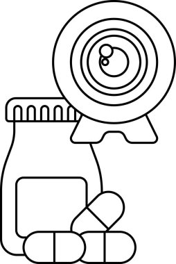 Kamera lensinin yanında bir kavanoz hap var. Kamera lensi siyah beyaz.