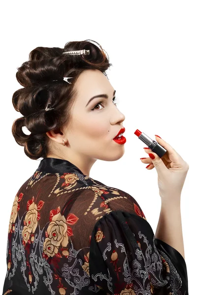 Pin-up Dame in Unterwäsche mit rotem Lippenstift in der Hand — Stockfoto