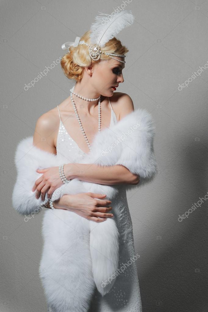 White Fur Stole >> Woman In White Dress With Shoulder Straps And Long Fur Stole Stock White Fur Stole >> Woman In White Dress With Shoulder Straps And Long Fur Stole Stock