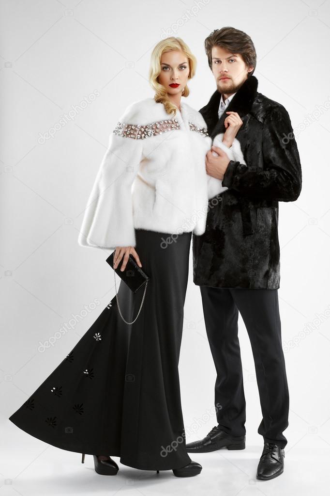 stylish man and glamour woman in fur coat posing