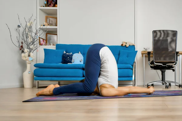 Young Woman Practicing Yoga Home Doing Plow Pose — Stock Photo, Image