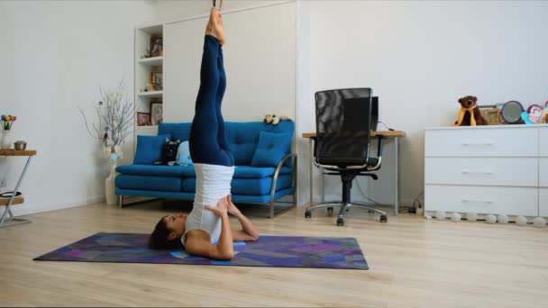 Young Woman Does Supported Shoulderstand Yoga Pose Home — Stock Video