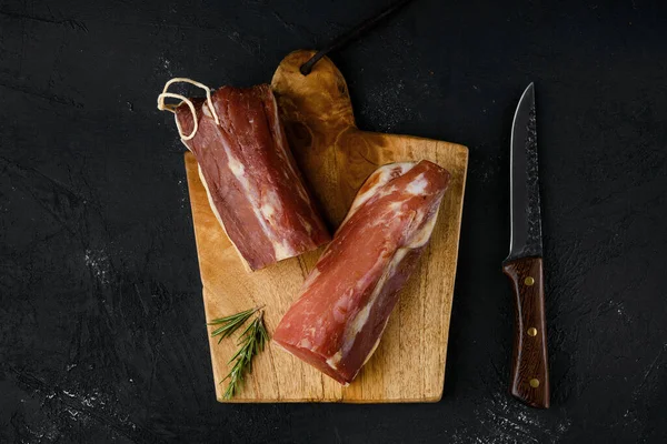 Top view of smoked beef fillet meat on cutting board