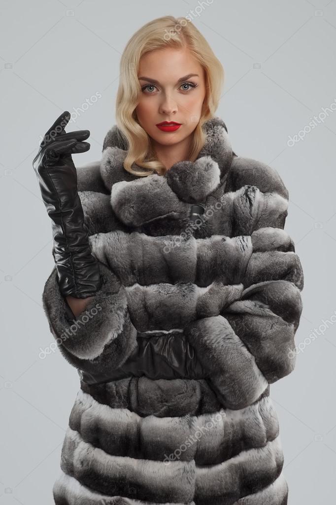 Broom apparat ligevægt Pretty lady in fur coat and leather gloves Stock Photo by ©boomeart 92017034